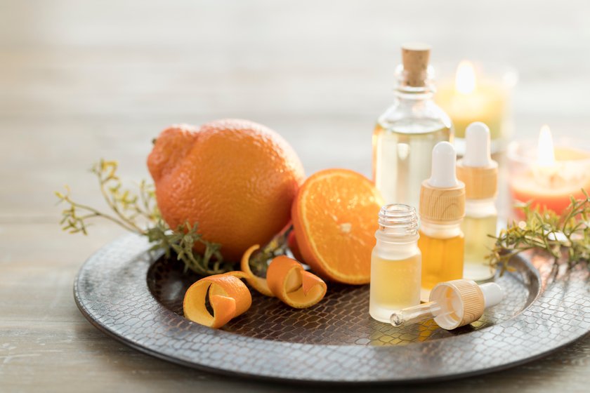 Essential Oils with Oranges and Candles.