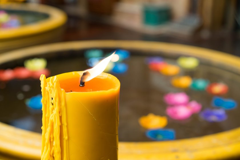 Big Yellow candle In the temple Buddha